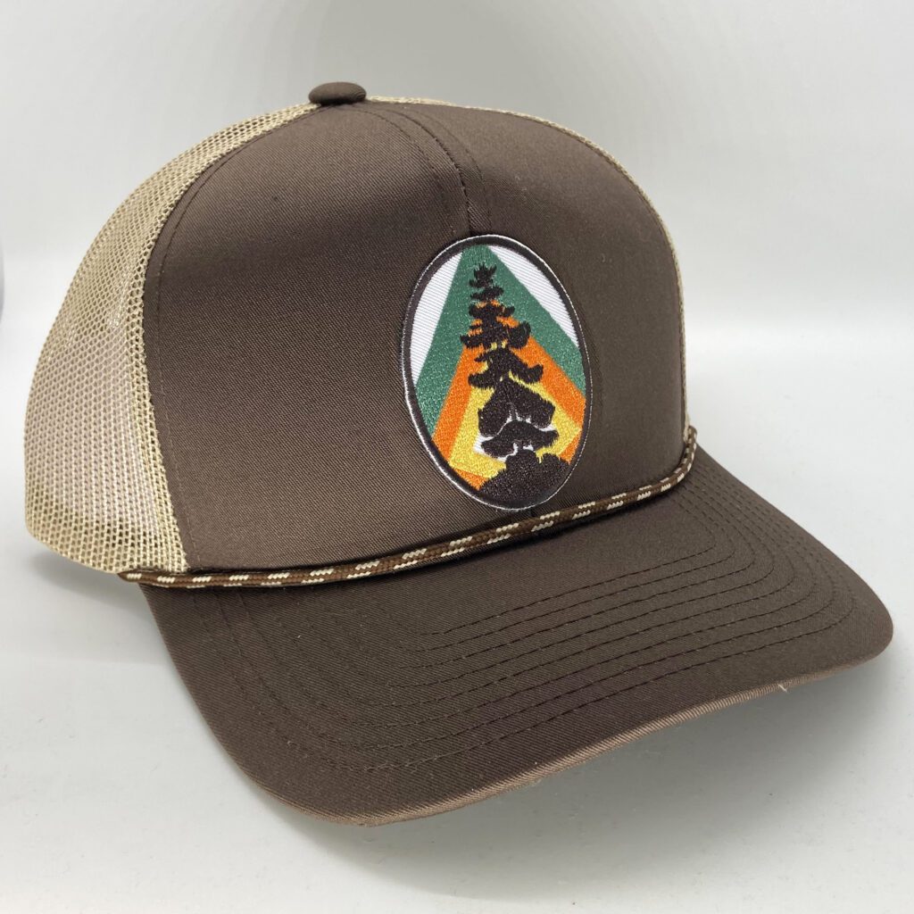 L3 tree patch on brown trucker hat with rope accent