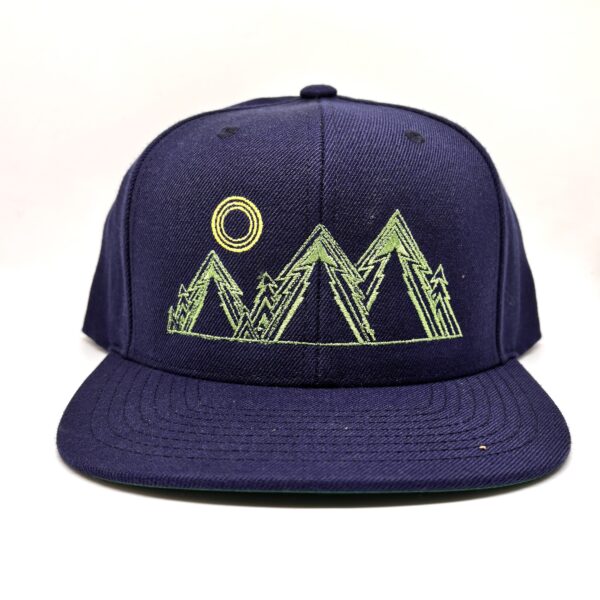 Electric trees hat design from Live the Life you Love in Navy or Purple. Flay brim